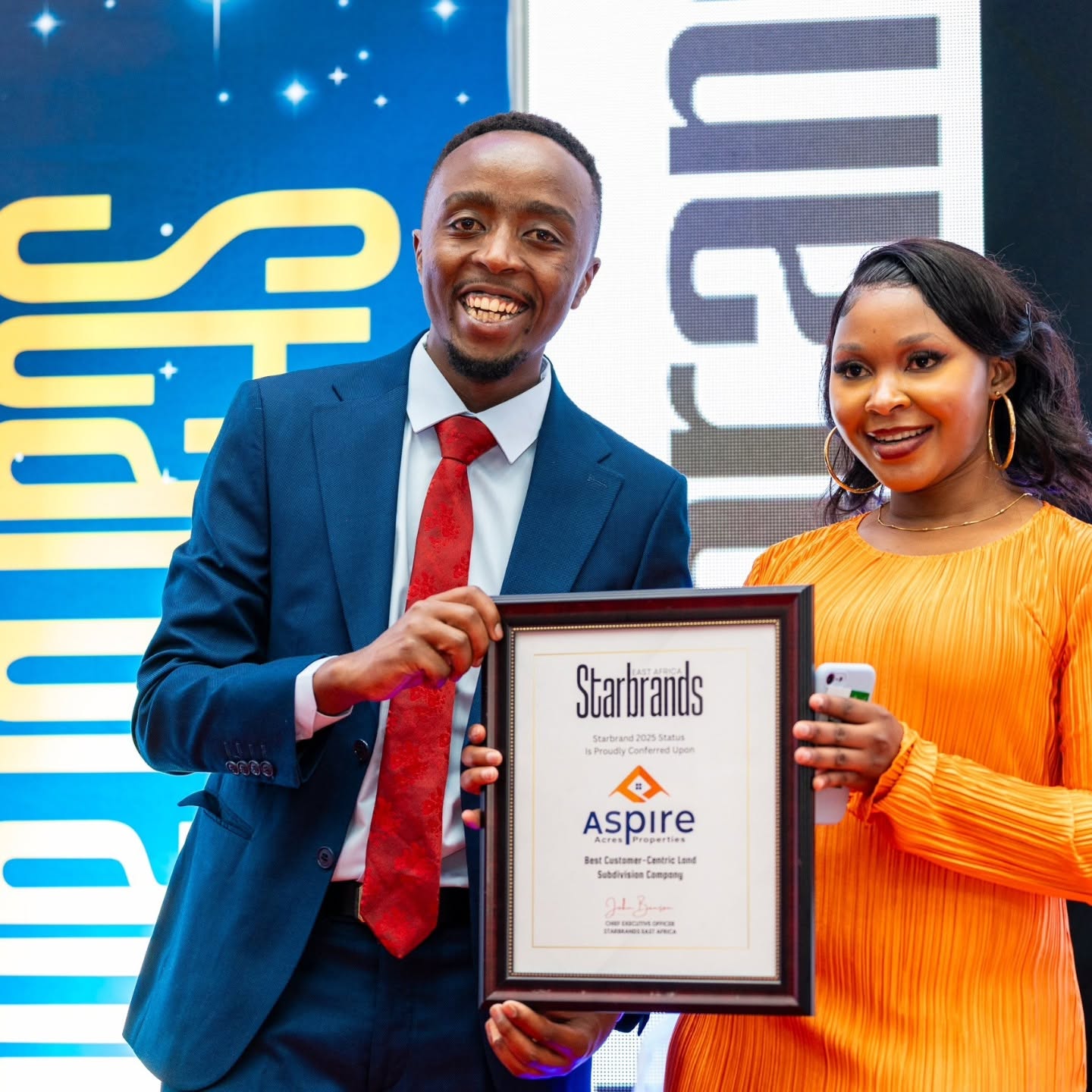 Aspire Acres Properties receiving Starbrands award